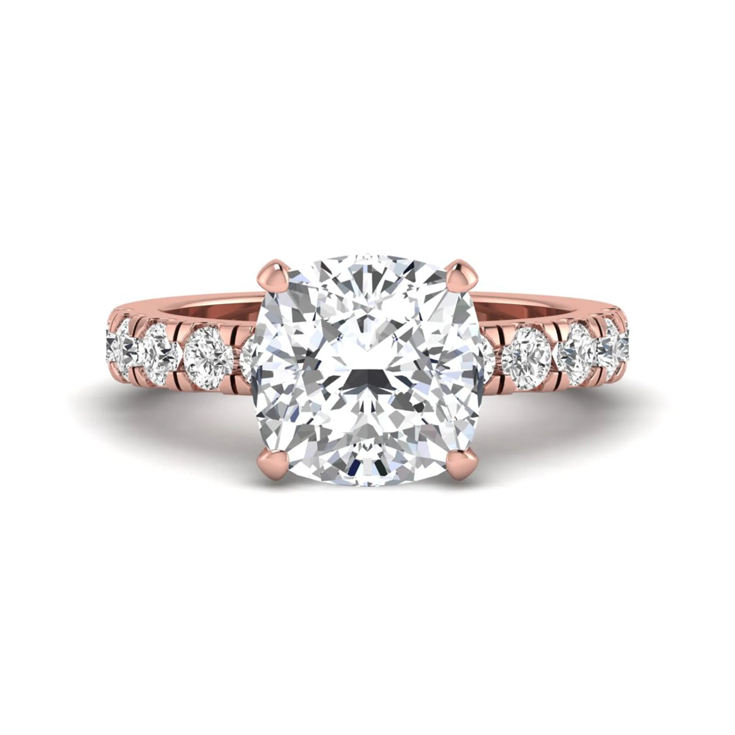 Cushion cut lab grown diamond solitaire engagement ring featuring a four-prong setting with a shared prong round diamond band in a rose gold tone design.