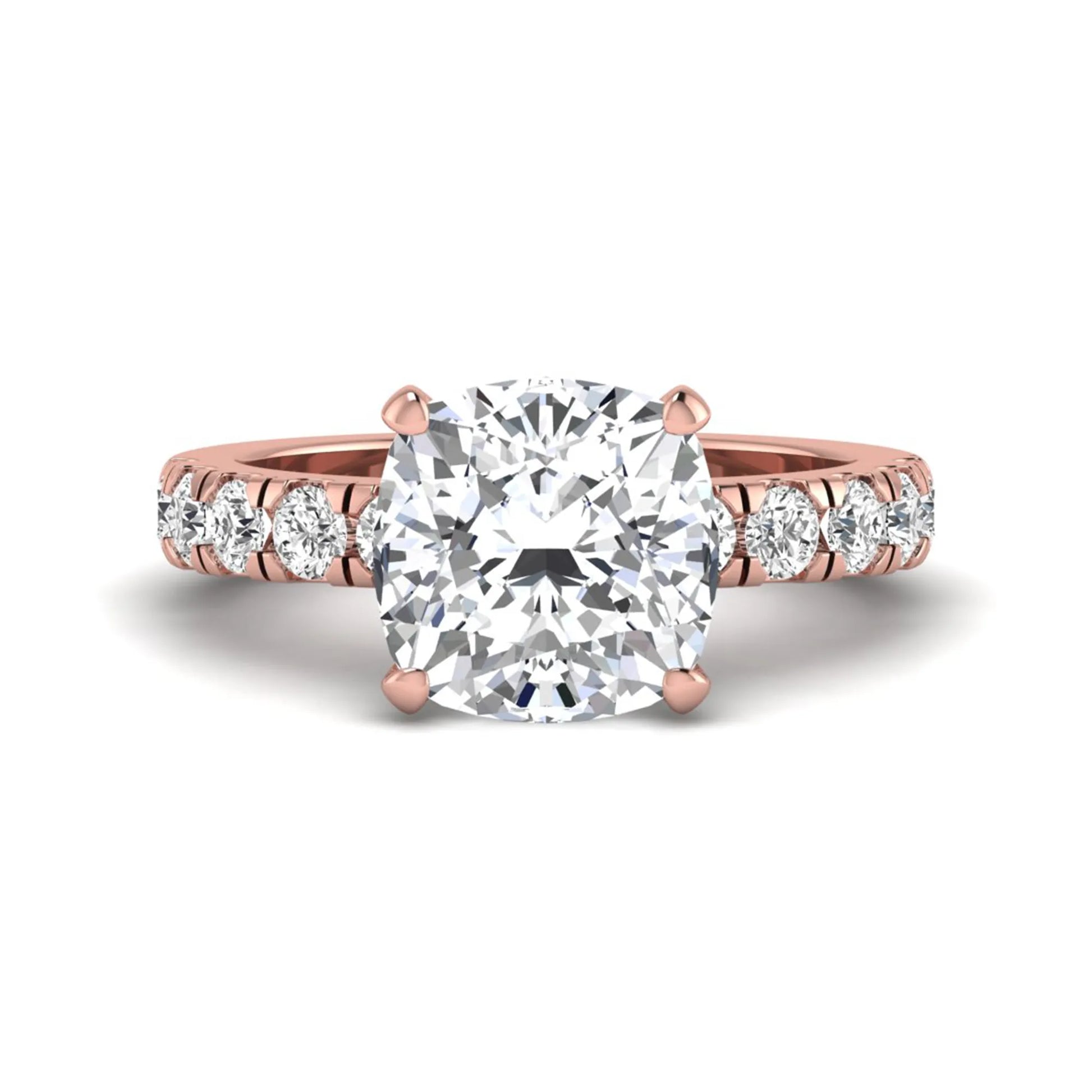 Cushion cut lab grown diamond solitaire engagement ring featuring a four-prong setting with a shared prong round diamond band in a rose gold tone design.