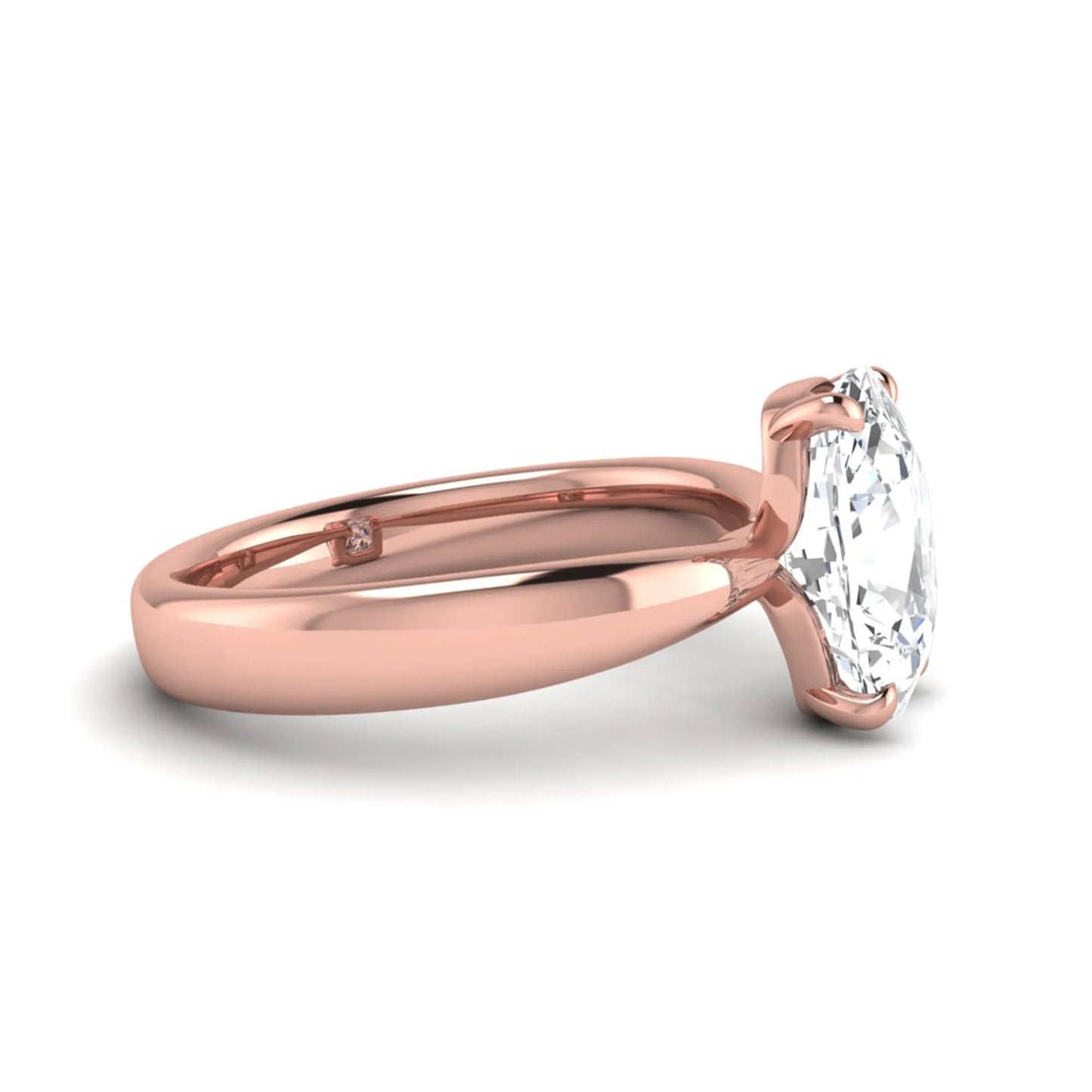 Cushion cut lab grown diamond solitaire engagement ring featuring a four-prong setting with a polished rose gold tone band.