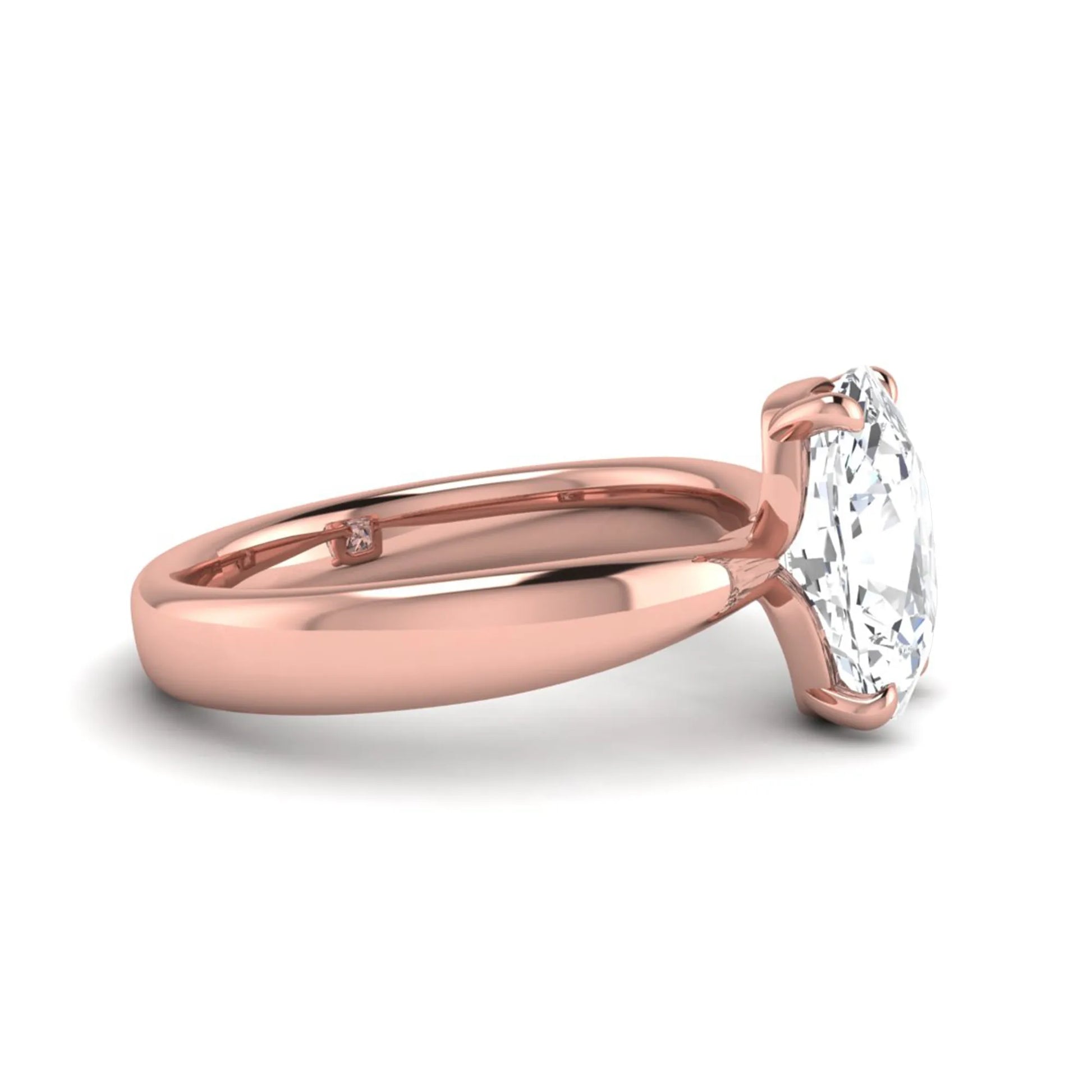 Cushion cut lab grown diamond solitaire engagement ring featuring a four-prong setting with a polished rose gold tone band.
