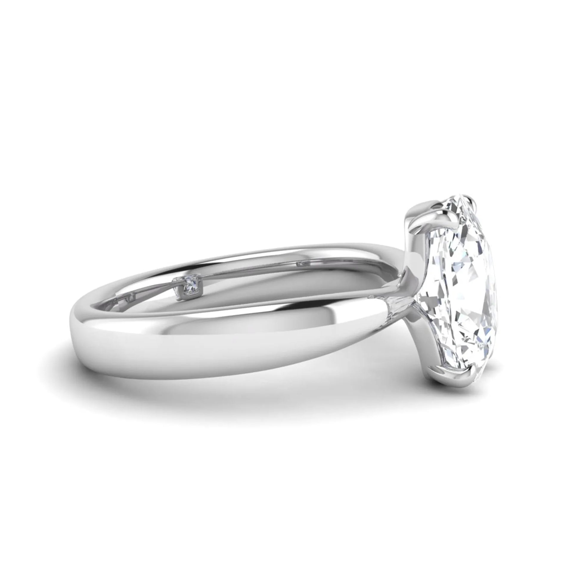 Cushion cut lab grown diamond solitaire engagement ring featuring a four-prong setting with a polished white gold tone band.