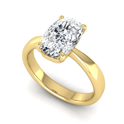 Cushion cut lab grown diamond solitaire engagement ring featuring a four-prong setting with a polished yellow gold tone band.