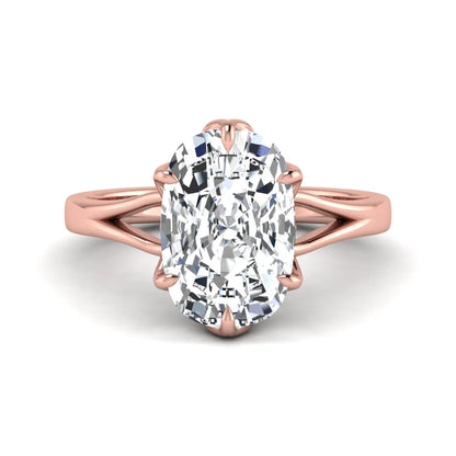 Elongated cushion cut lab grown diamond solitaire engagement ring featuring a four-prong setting with a split cathedral shank in a rose gold tone design.