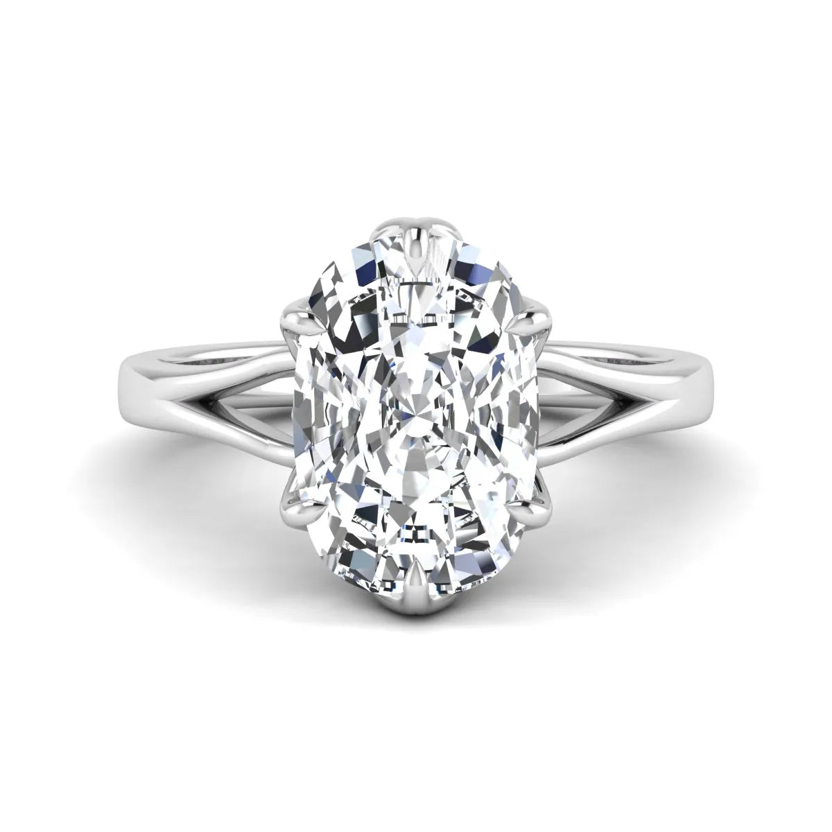 Elongated cushion cut lab grown diamond solitaire engagement ring featuring a four-prong setting with a split cathedral shank in a white gold tone design.