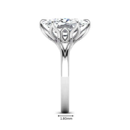 Elongated cushion cut lab grown diamond solitaire engagement ring featuring a four-prong setting with a split cathedral shank in a white gold tone design.