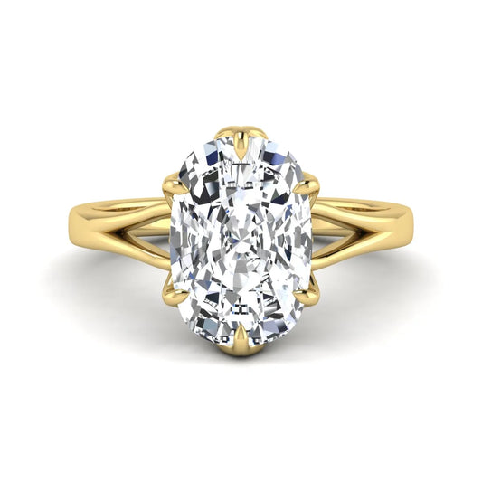 Elongated cushion cut lab grown diamond solitaire engagement ring featuring a four-prong setting with a split cathedral shank in a yellow gold tone design.