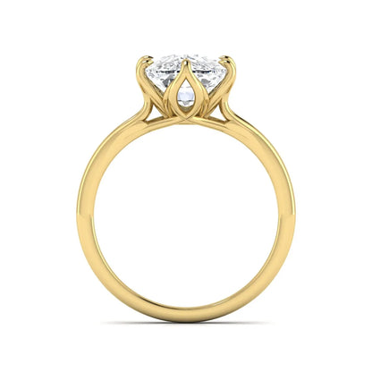 Elongated cushion cut lab grown diamond solitaire engagement ring featuring a four-prong setting with a split cathedral shank in a yellow gold tone design.