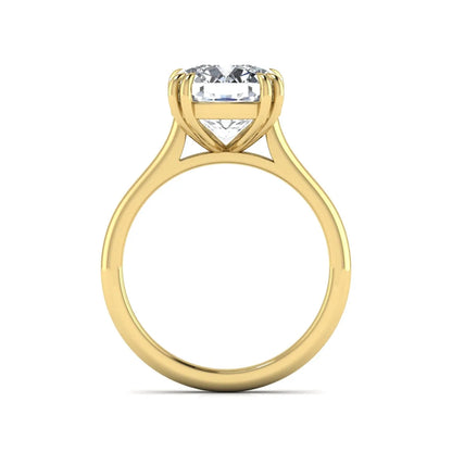 Cushion cut lab grown diamond solitaire engagement ring with classic prong setting and yellow gold tone shown for design reference.