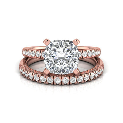 Cushion cut lab grown diamond solitaire engagement ring with matching pavé diamond wedding band in rose gold.