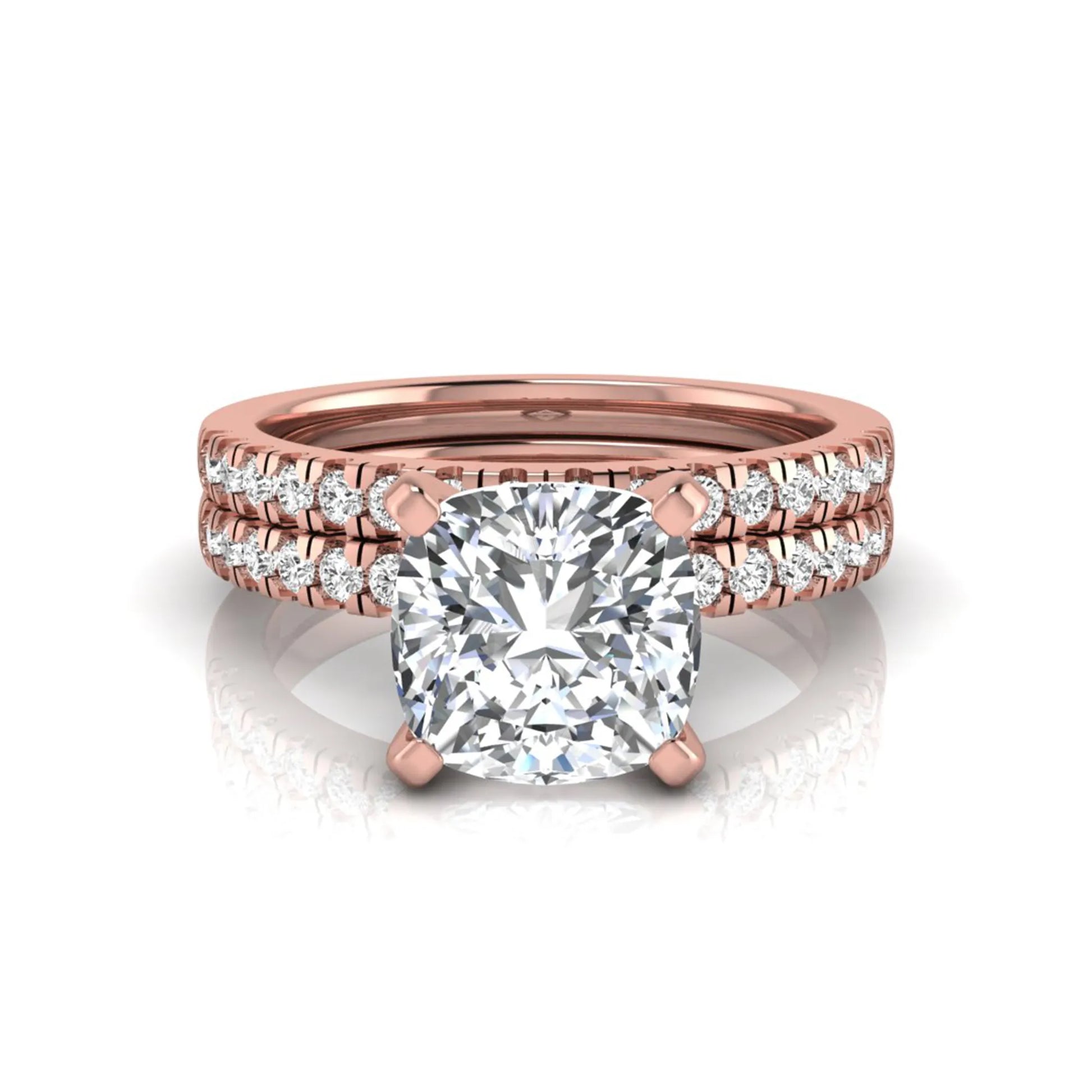 Cushion cut lab grown diamond solitaire engagement ring with matching pavé diamond wedding band in rose gold.