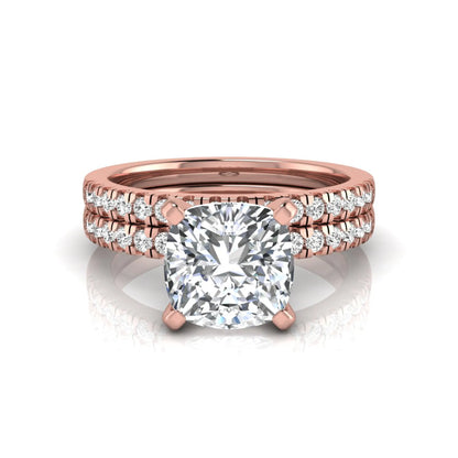 Cushion cut lab grown diamond solitaire engagement ring with matching pavé diamond wedding band in rose gold.