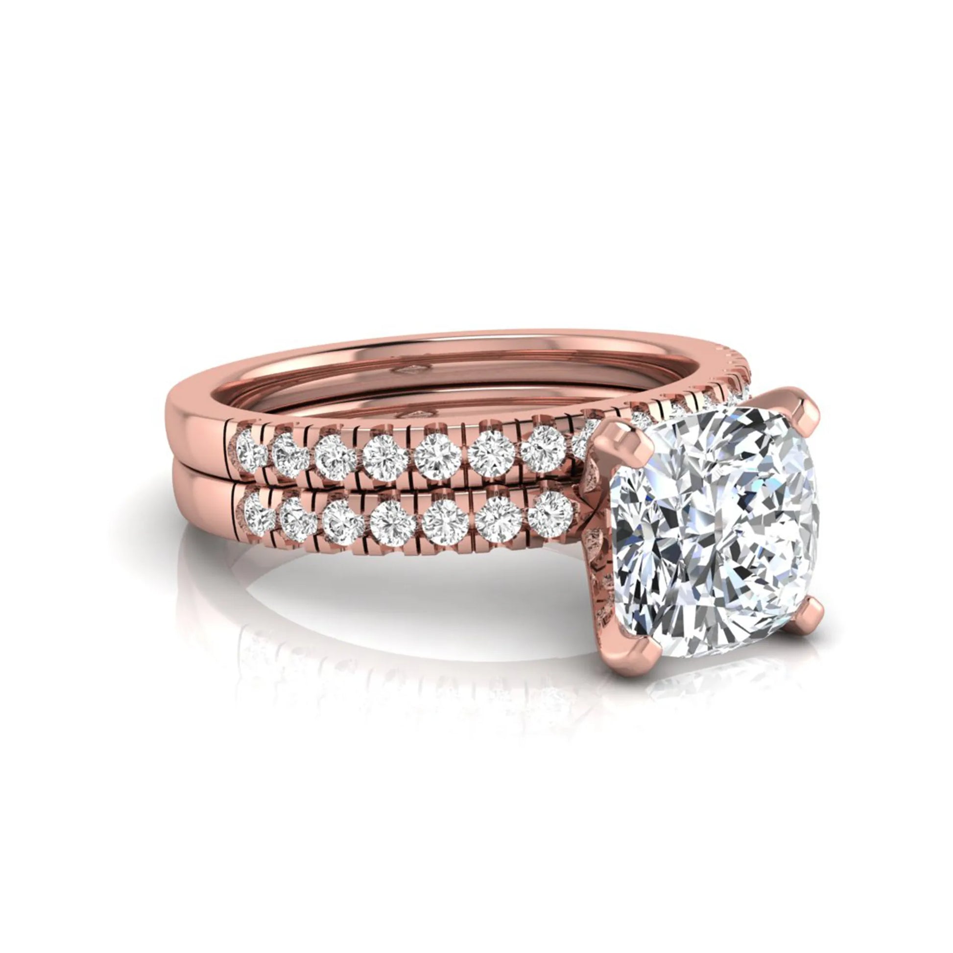 Cushion cut lab grown diamond solitaire engagement ring with matching pavé diamond wedding band in rose gold.
