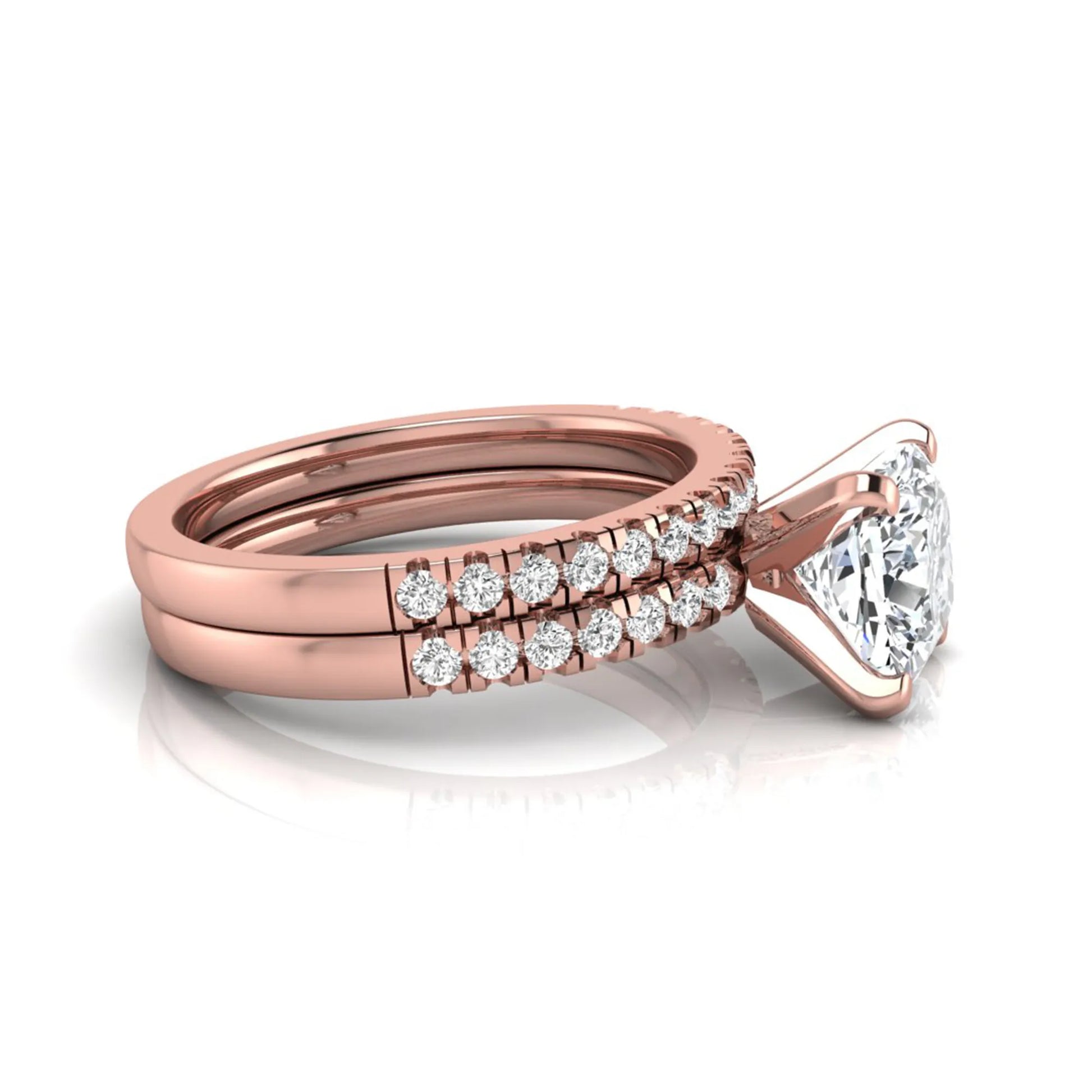 Cushion cut lab grown diamond solitaire engagement ring with matching pavé diamond wedding band in rose gold.