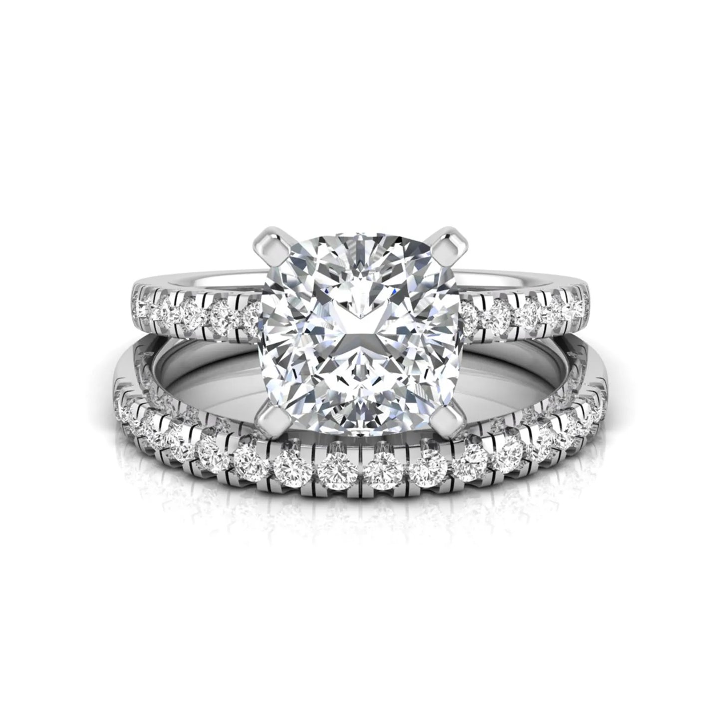 Cushion cut lab grown diamond solitaire engagement ring with matching pavé diamond wedding band in white gold.