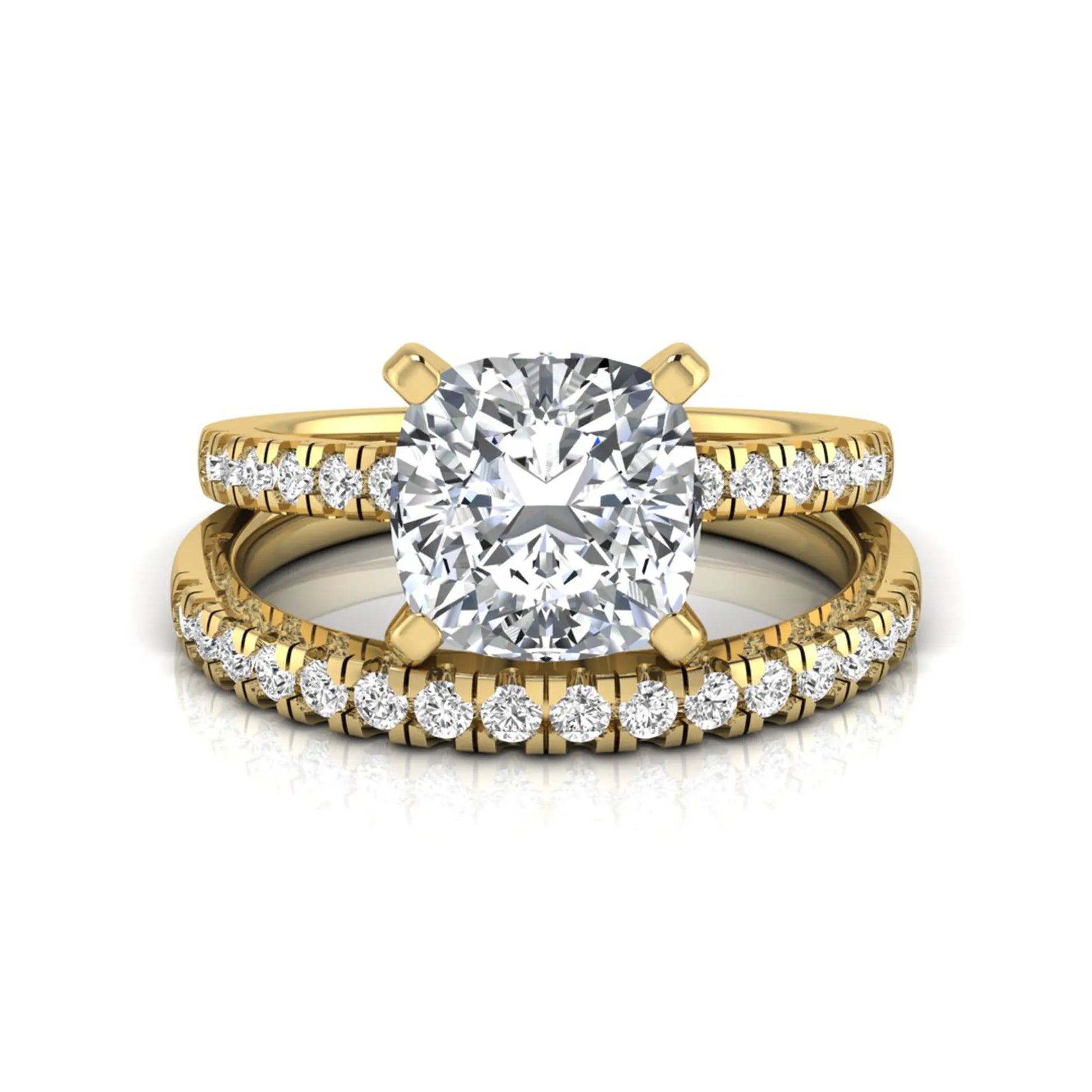 Cushion cut lab grown diamond solitaire engagement ring with matching pavé diamond wedding band in yellow gold.