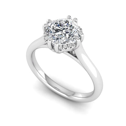 Cushion cut lab grown diamond solitaire engagement ring with double claw prongs, diamond-accented open cathedral gallery, and polished white gold band.