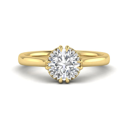 Cushion cut lab grown diamond solitaire engagement ring with double claw prongs, diamond-accented open cathedral gallery, and polished yellow gold band.