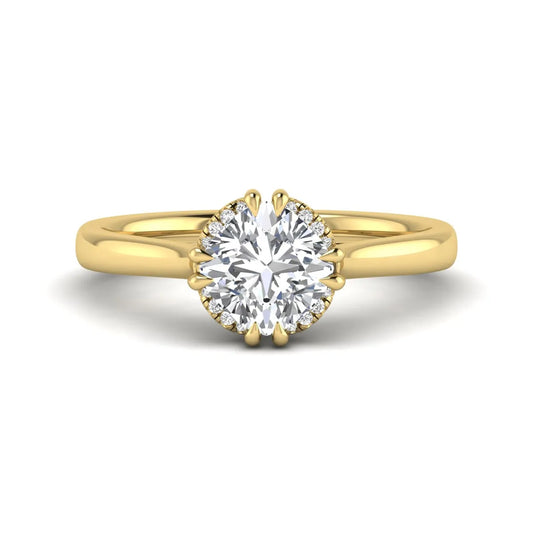 Cushion cut lab grown diamond solitaire engagement ring with double claw prongs, diamond-accented open cathedral gallery, and polished yellow gold band.
