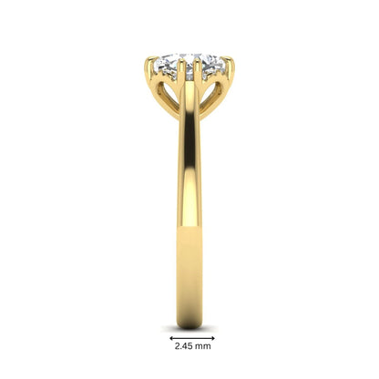 Cushion cut lab grown diamond solitaire engagement ring with double claw prongs, diamond-accented open cathedral gallery, and polished yellow gold band.