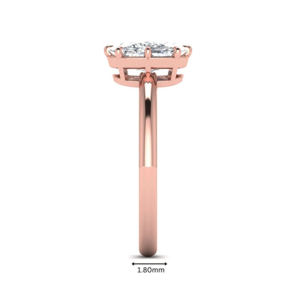 Cushion cut lab grown diamond solitaire engagement ring featuring an eight-prong setting with a polished rose gold band.