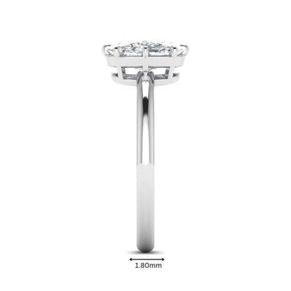 Cushion cut lab grown diamond solitaire engagement ring featuring an eight-prong setting with a polished white gold band.