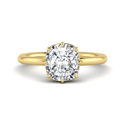 Cushion cut lab grown diamond solitaire engagement ring featuring an eight-prong setting with a polished yellow gold band.