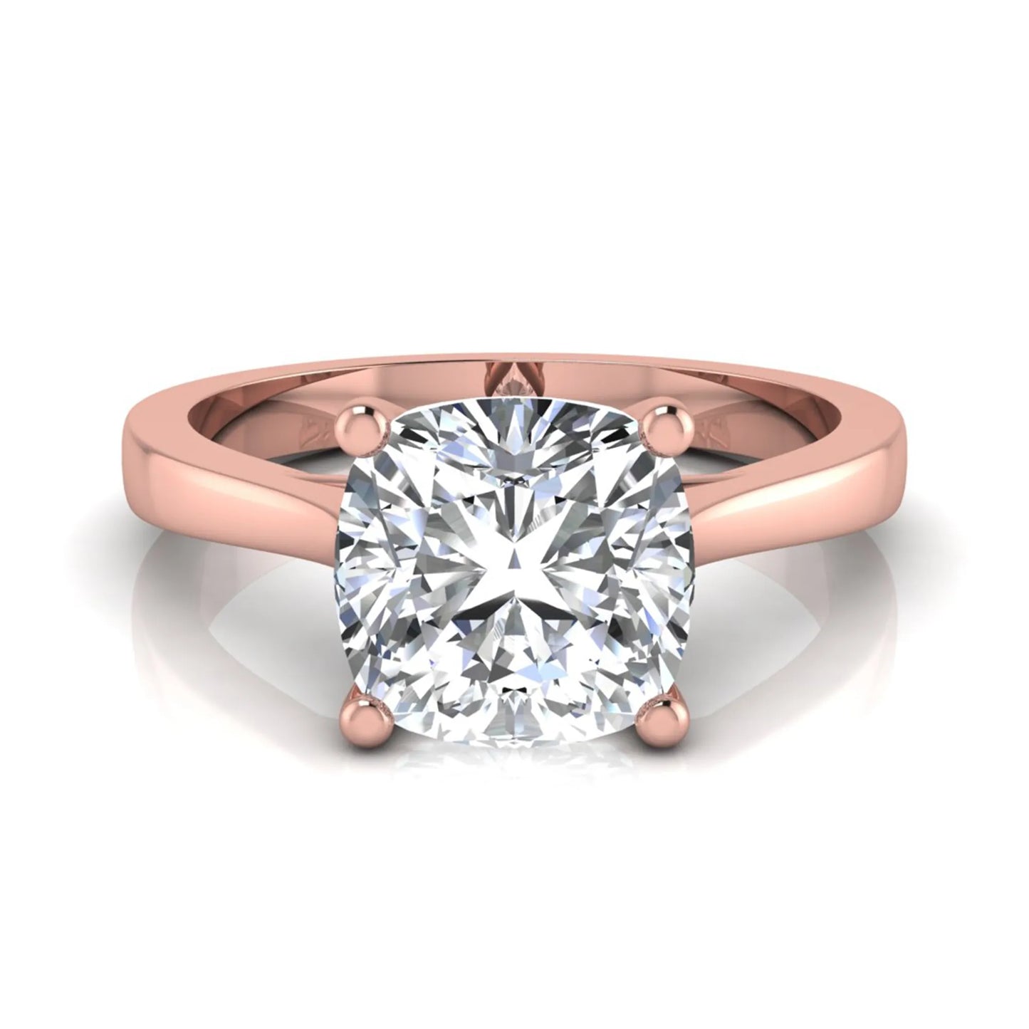 Cushion cut lab grown diamond solitaire engagement ring featuring an IGI certified center diamond in a classic four-prong setting with a polished band in rose gold