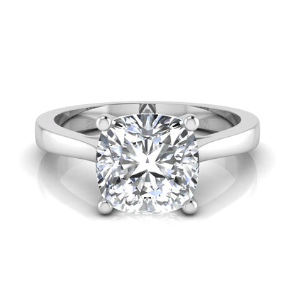 Cushion cut lab grown diamond solitaire engagement ring featuring an IGI certified center diamond in a classic four-prong setting with a polished band in white gold