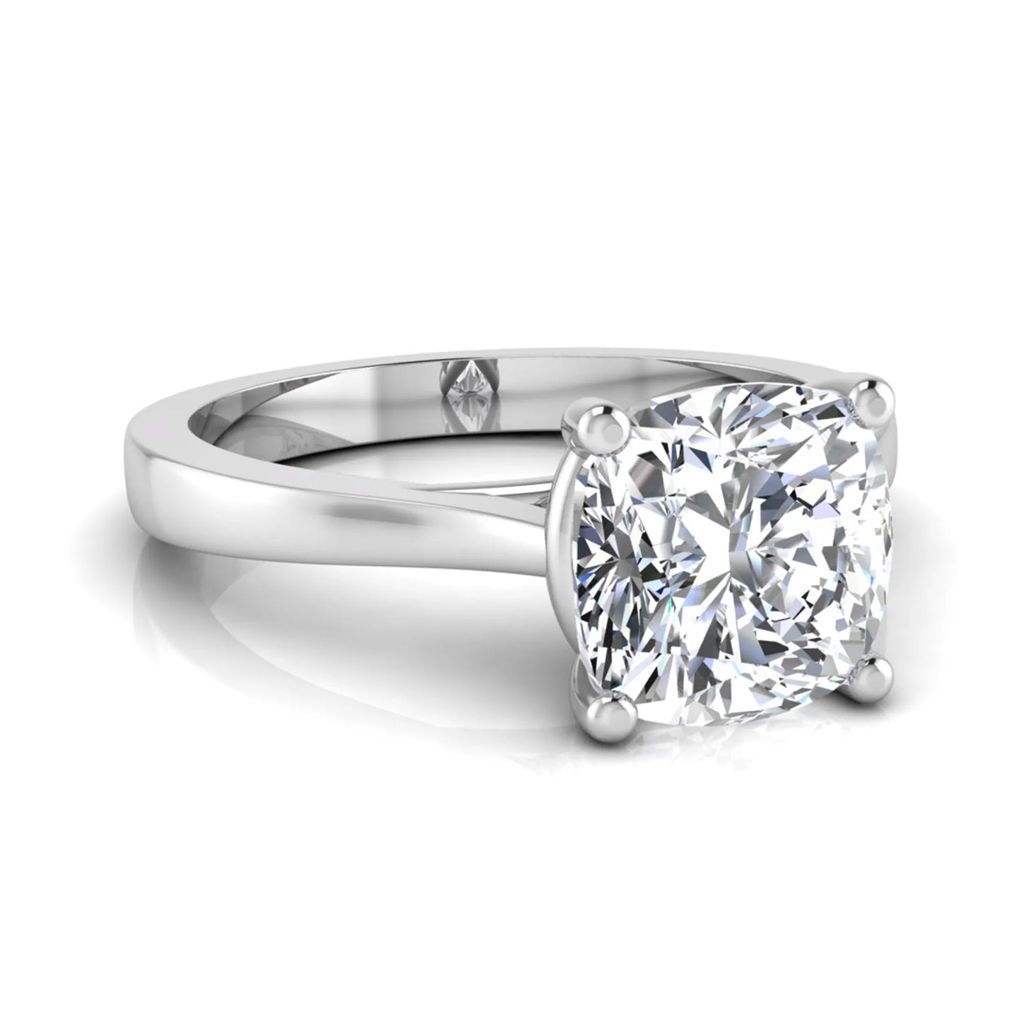 Cushion cut lab grown diamond solitaire engagement ring featuring an IGI certified center diamond in a classic four-prong setting with a polished band in white gold