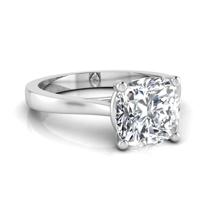 Cushion cut lab grown diamond solitaire engagement ring featuring an IGI certified center diamond in a classic four-prong setting with a polished band in white gold