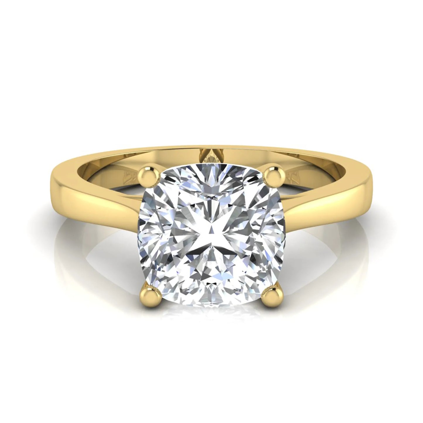 Cushion cut lab grown diamond solitaire engagement ring featuring an IGI certified center diamond in a classic four-prong setting with a polished band in yellow gold