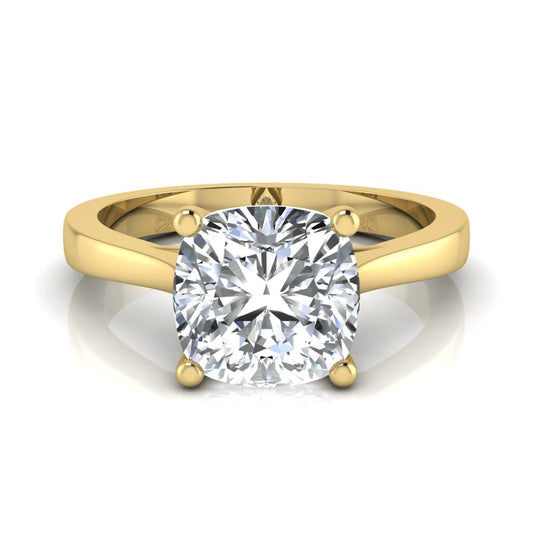 Cushion cut lab grown diamond solitaire engagement ring featuring an IGI certified center diamond in a classic four-prong setting with a polished band in yellow gold