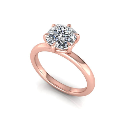 Cushion cut lab grown diamond engagement ring featuring a 1.28 carat IGI certified center diamond in a classic four-prong solitaire setting with a polished rose gold band.