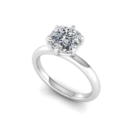 Cushion cut lab grown diamond engagement ring featuring a 1.28 carat IGI certified center diamond in a classic four-prong solitaire setting with a polished white gold band.