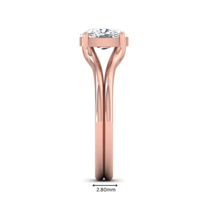 Cushion cut lab grown diamond solitaire engagement ring featuring a split shank band and four-prong setting in polished rose gold.