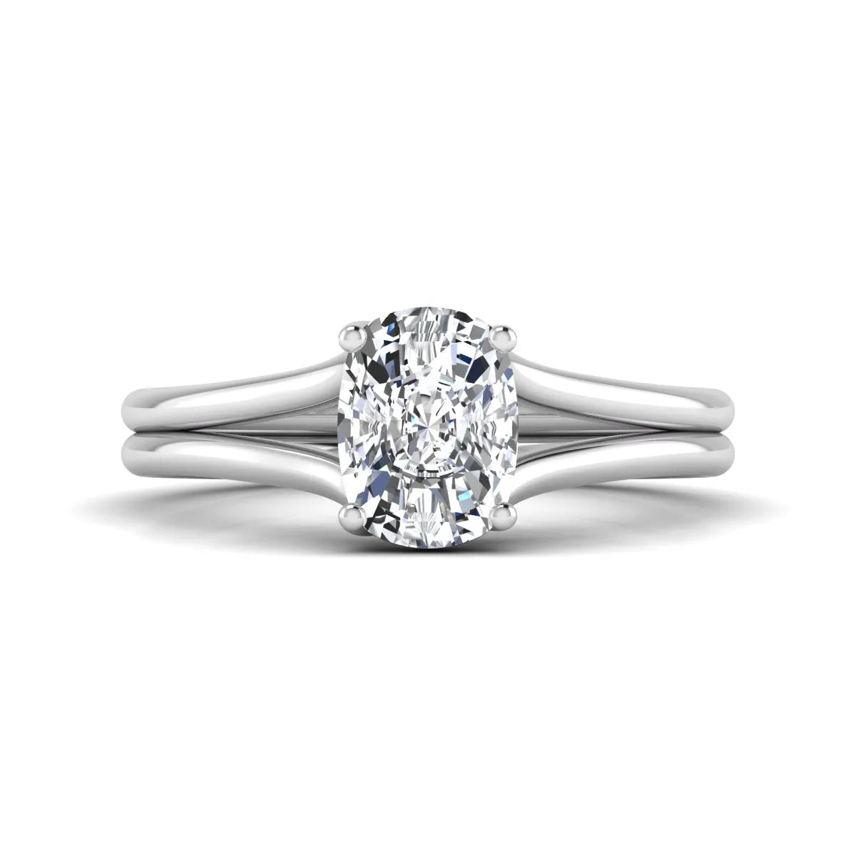 Cushion cut lab grown diamond solitaire engagement ring featuring a split shank band and four-prong setting in polished white gold.