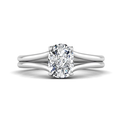 Cushion cut lab grown diamond solitaire engagement ring featuring a split shank band and four-prong setting in polished white gold.
