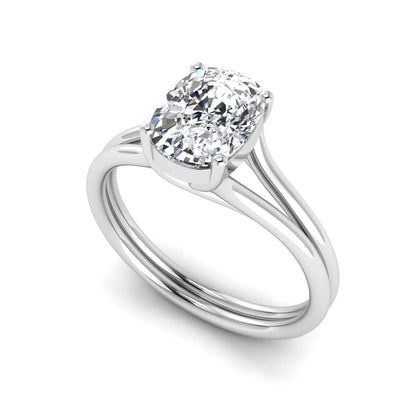 Cushion cut lab grown diamond solitaire engagement ring featuring a split shank band and four-prong setting in polished white gold.