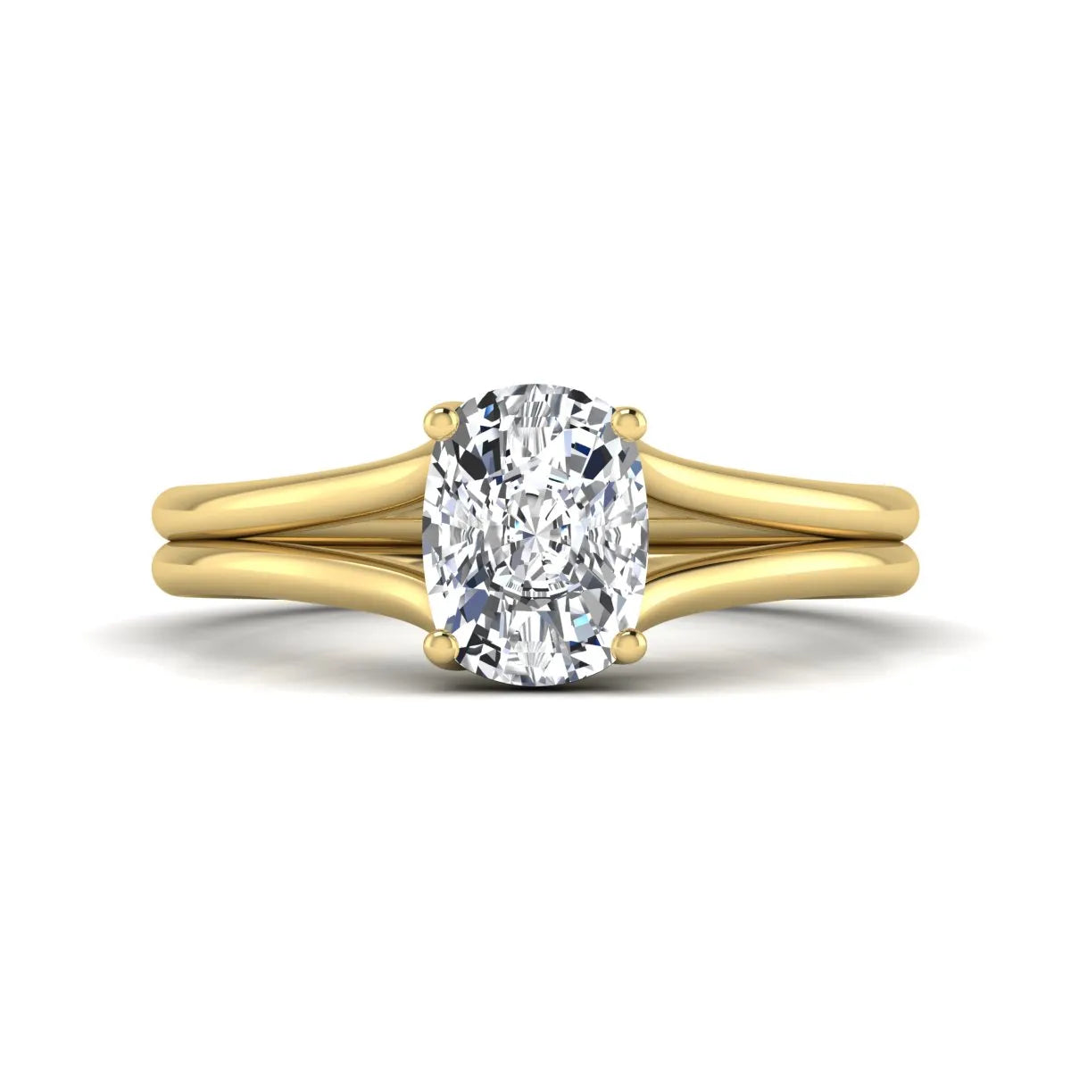 Cushion cut lab grown diamond solitaire engagement ring featuring a split shank band and four-prong setting in polished yellow gold.