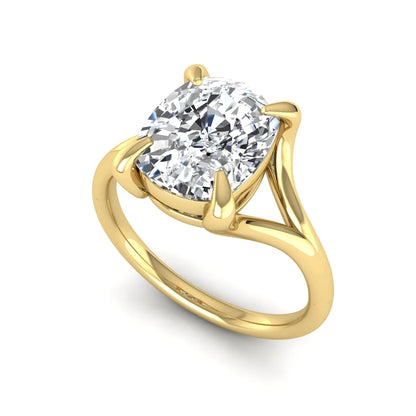 IGI Certified 2.97 carat cushion cut lab grown diamond split shank engagement ring with claw prong setting in yellow gold.