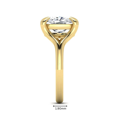 IGI Certified 2.97 carat cushion cut lab grown diamond split shank engagement ring with claw prong setting in yellow gold.
