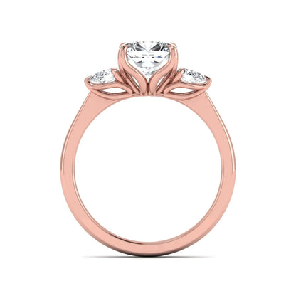 Cushion cut three stone lab grown diamond engagement ring featuring a 1.67 carat IGI certified center diamond with pear side diamonds in rose gold.