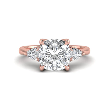 Cushion cut three stone lab grown diamond engagement ring featuring a 1.67 carat IGI certified center diamond with pear side diamonds in rose gold.