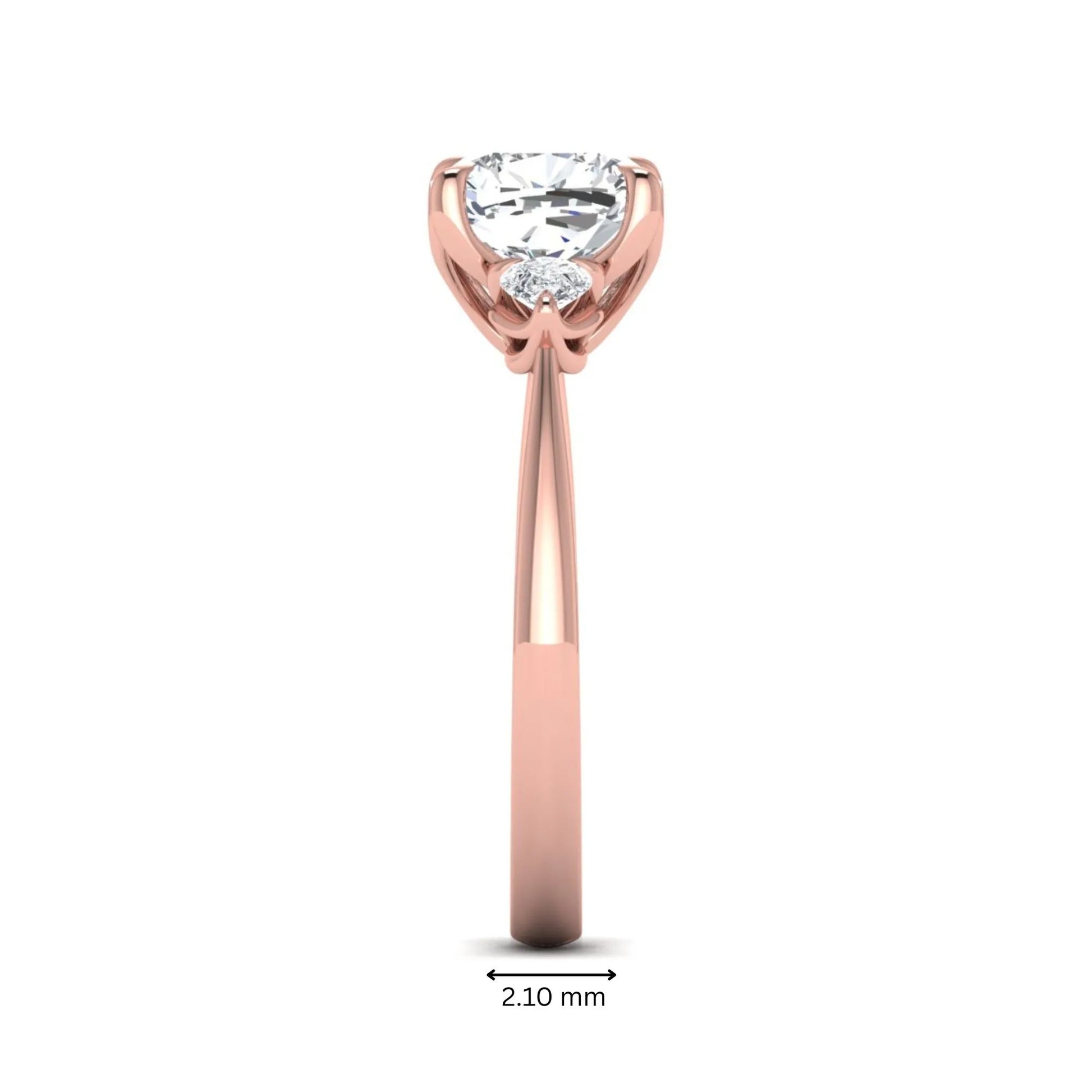 Cushion cut three stone lab grown diamond engagement ring featuring a 1.67 carat IGI certified center diamond with pear side diamonds in rose gold.