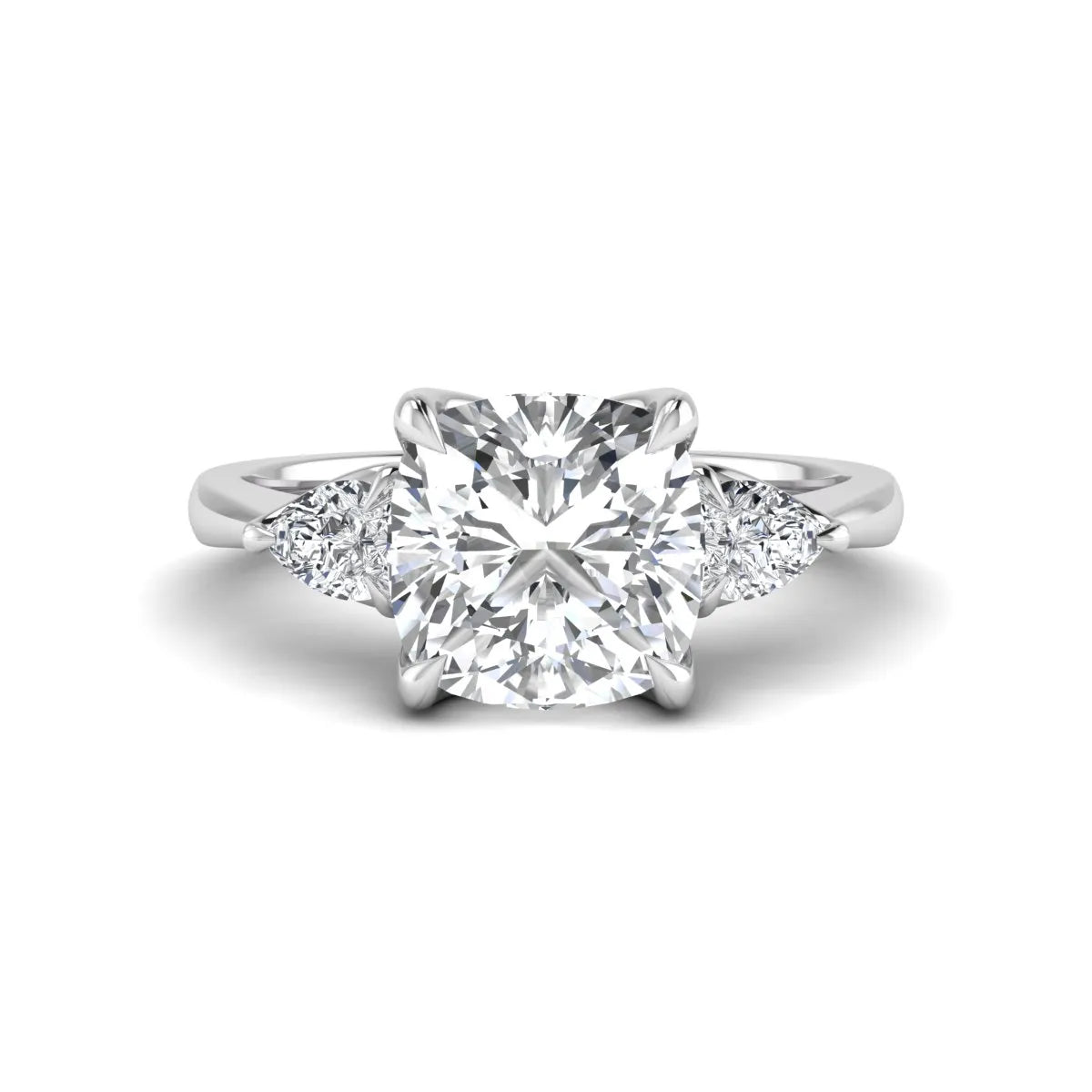 Cushion cut three stone lab grown diamond engagement ring featuring a 1.67 carat IGI certified center diamond with pear side diamonds in white gold.
