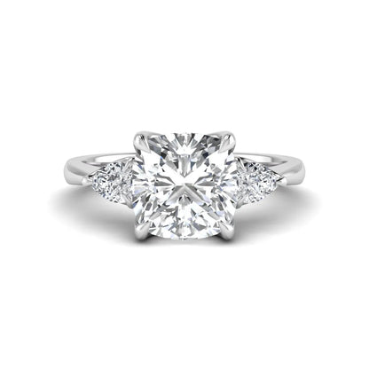 Cushion cut three stone lab grown diamond engagement ring featuring a 1.67 carat IGI certified center diamond with pear side diamonds in white gold.