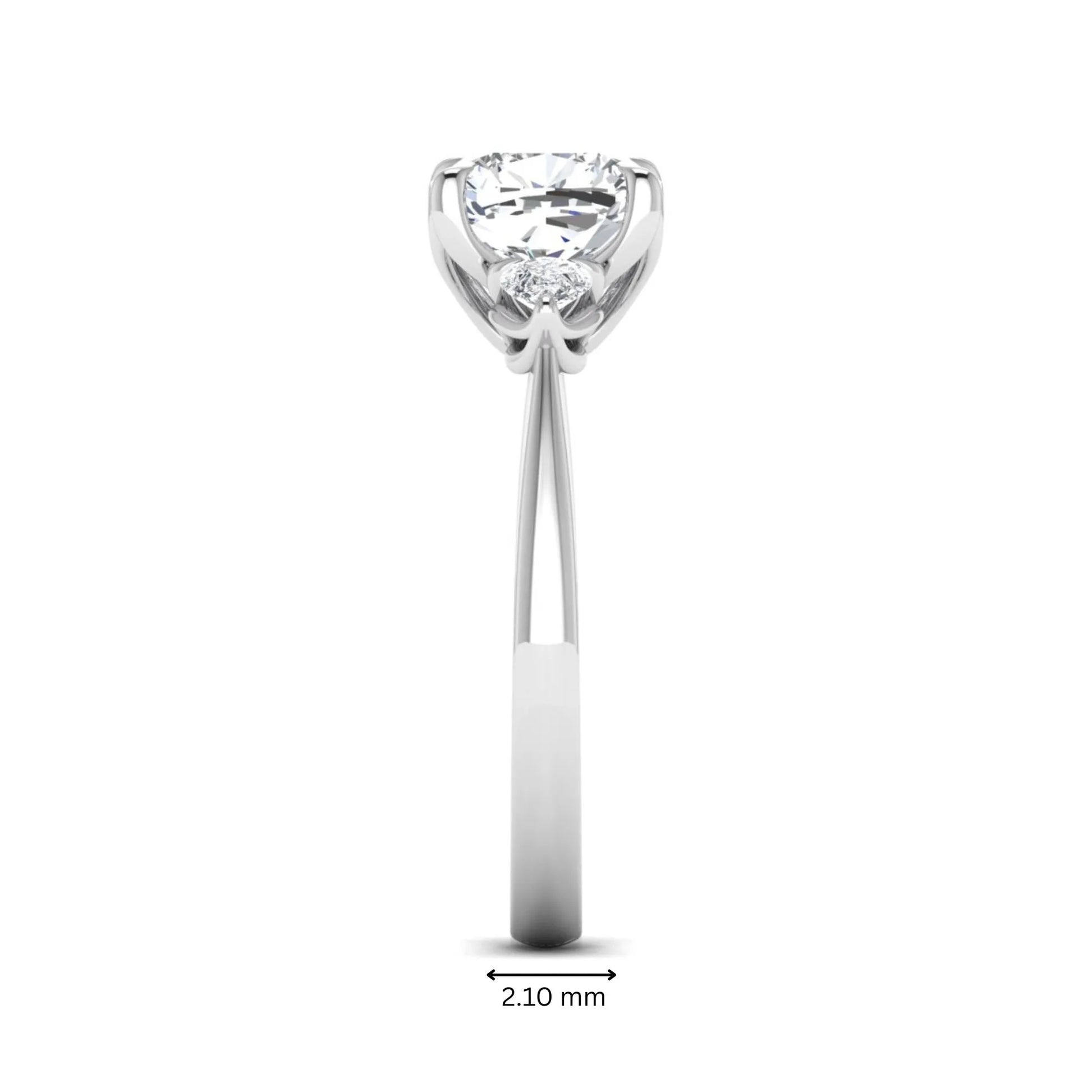 Cushion cut three stone lab grown diamond engagement ring featuring a 1.67 carat IGI certified center diamond with pear side diamonds in white gold.