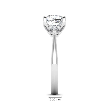 Cushion cut three stone lab grown diamond engagement ring featuring a 1.67 carat IGI certified center diamond with pear side diamonds in white gold.