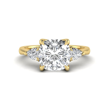 Cushion cut three stone lab grown diamond engagement ring featuring a 1.67 carat IGI certified center diamond with pear side diamonds in yellow gold.