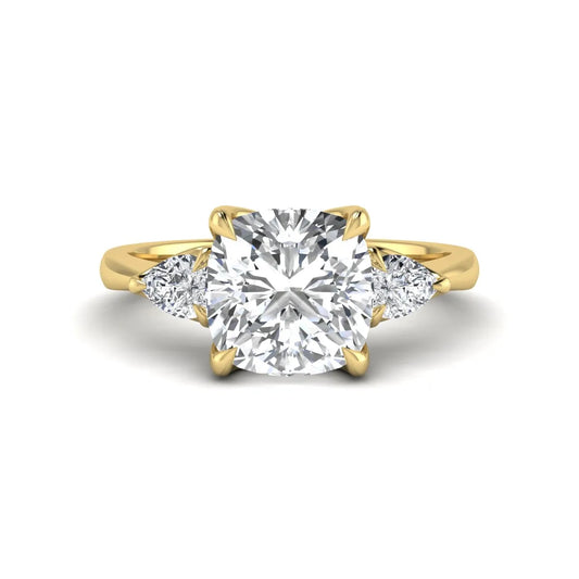 Cushion cut three stone lab grown diamond engagement ring featuring a 1.67 carat IGI certified center diamond with pear side diamonds in yellow gold.